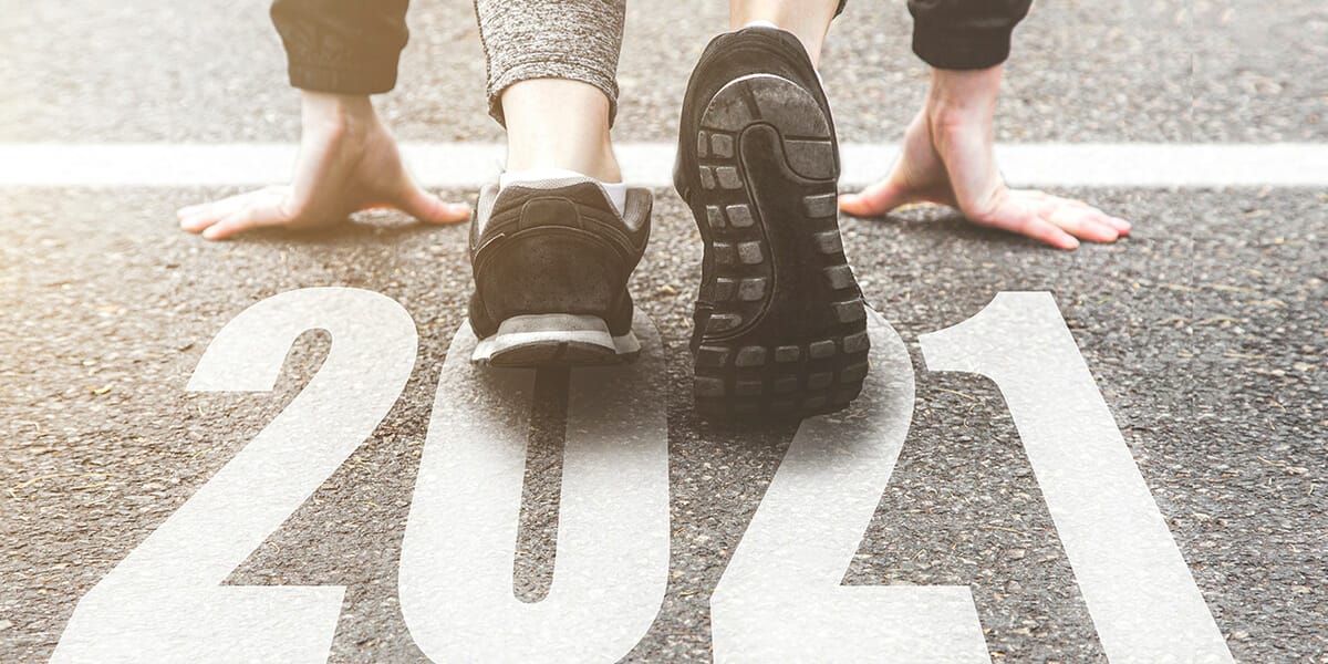 Runner on a starting line that says 2021