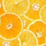 Sliced citrus fruits depicting vitamin c